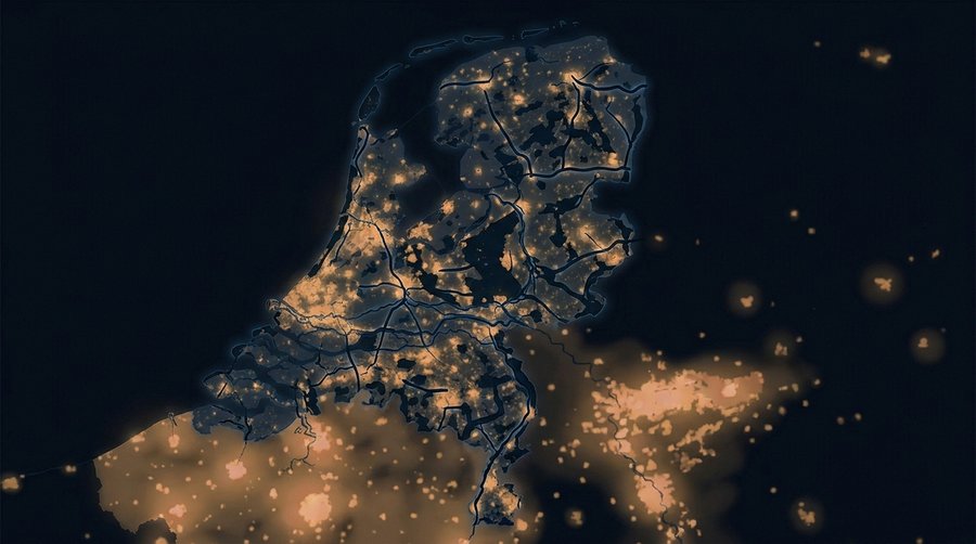 Netherlands map at night highlighting dark wildlife corridors threading between amber urban glow fields
